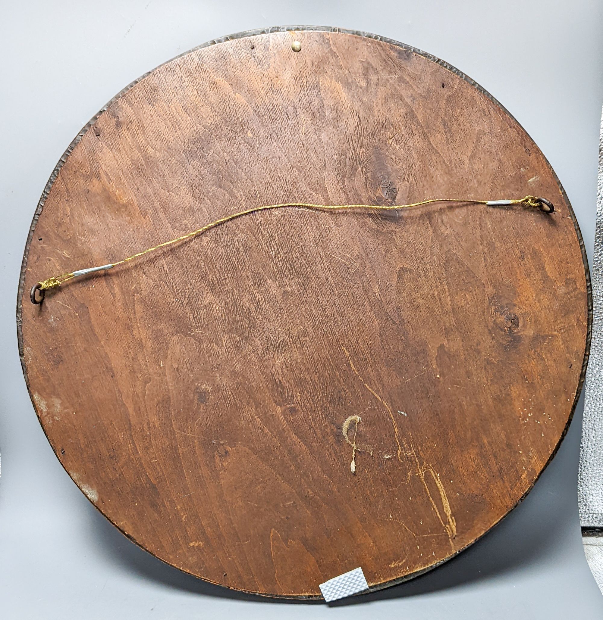 An Arts & Crafts circular copper mirror 56cm